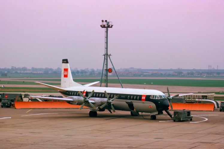 BEA Vanguard aircraft G APEI on ground at London Heathrow Airport under mysterious slightly pink overcast daylight 1962 JMH2713